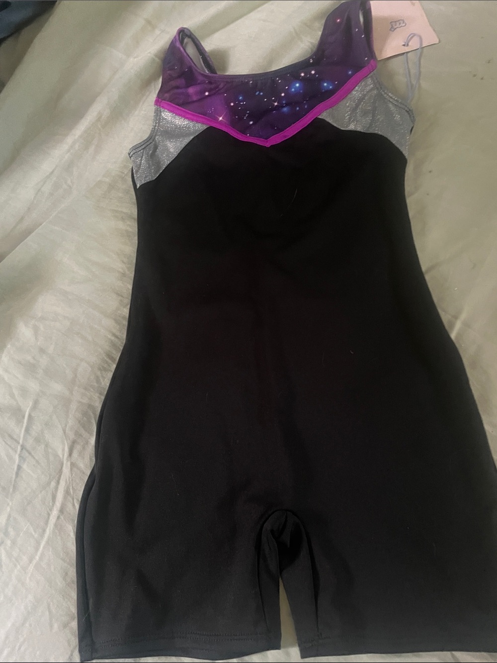More Than Magic Black One-Piece Bodysuit with Purple Galaxy Yoke and Pink Trim